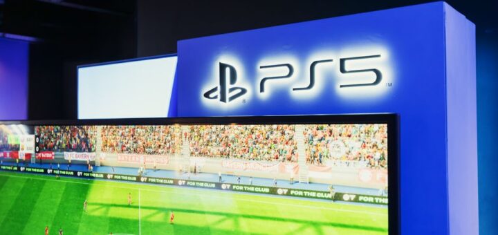 PS5 gaming station featuring a live soccer match onscreen, showcasing high-quality graphics.