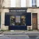 a building with a store front on the corner