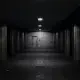 Dark, empty underground tunnel with dim lights and a door.