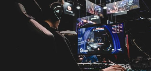 person sitting on gaming chair while playing video game