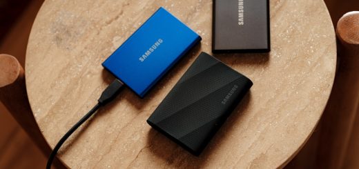 A table with a charger and a laptop on it