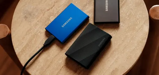 A table with a charger and a laptop on it