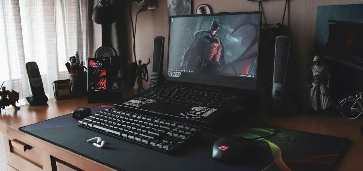 a laptop sits on top of a desk